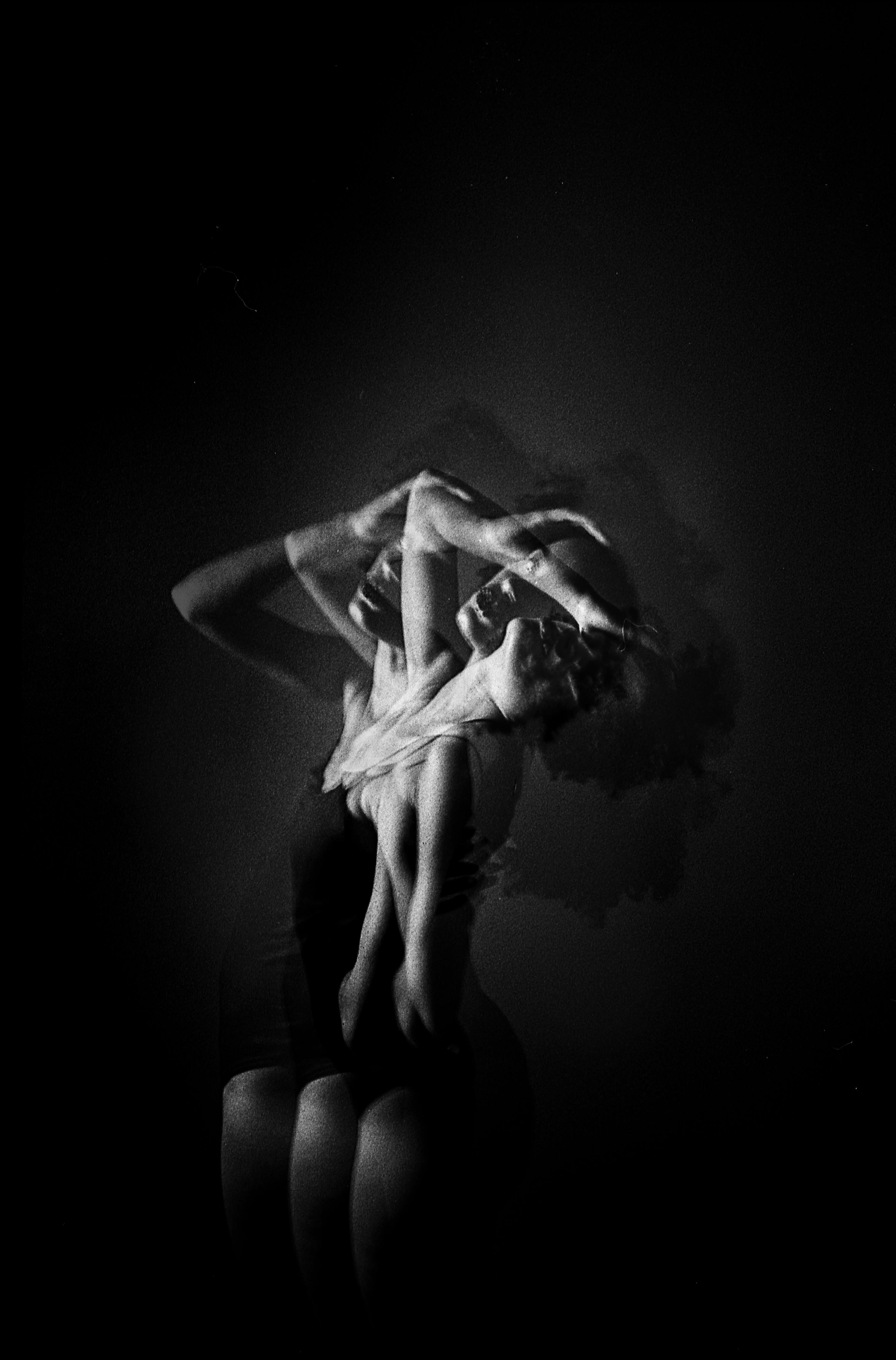 woman touching her head in underwear